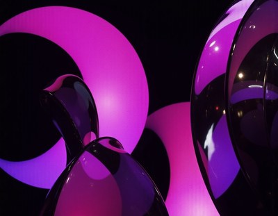 Purple and black abstract shapes illuminated by pink light