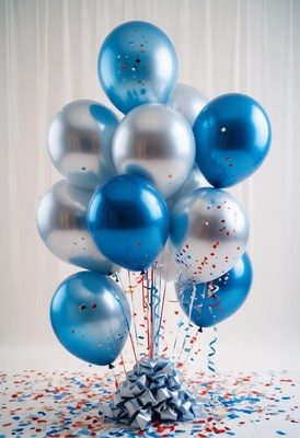 Blue and silver balloon bouquet with confetti on a table