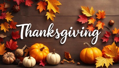 Happy thanksgiving, surrounded by autumn leaves and pumpkins