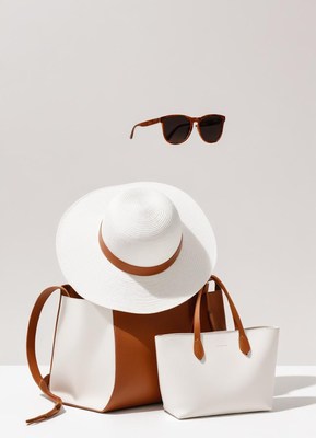 A white hat, two bags, and sunglasses for summer