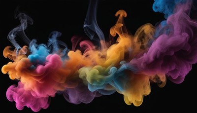 Colorful ink swirls in a dark studio