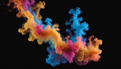 Colorful ink swirls through black water