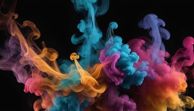 Colorful ink swirls in a dark studio
