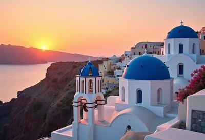 Sunset lights up santorini's white churches