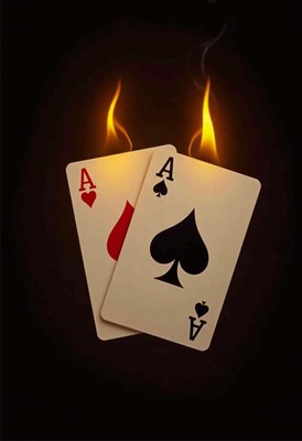 Two aces on fire against a dark background