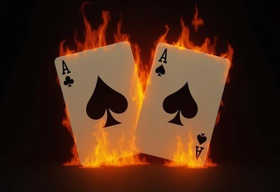 Two aces of spades are on fire