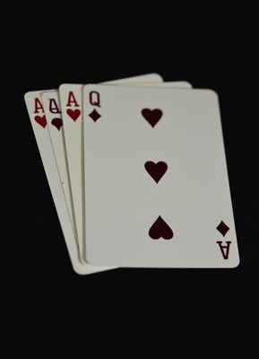 Four aces of hearts and diamonds are shown