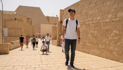 Walking through historic ruins in bright sunlight