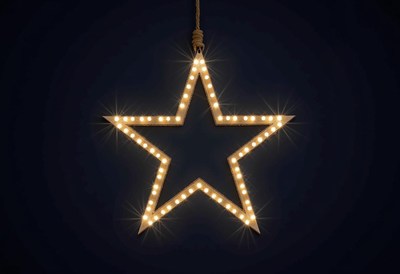 Bright star decoration hanging against a dark background