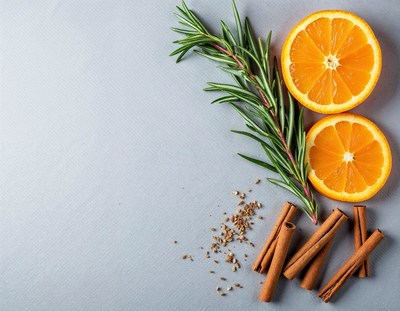 Spices and oranges arranged on a light blue surface