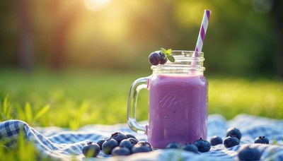 Refreshing berry smoothie served outdoors at sunset