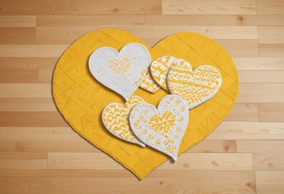 Heart-shaped decorations on a vibrant yellow rug