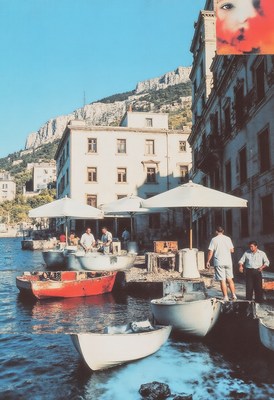 Vibrant boat activity near historic buildings by water