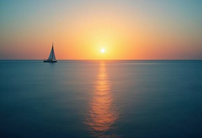 Sailboat at Sunset on Calm Sea