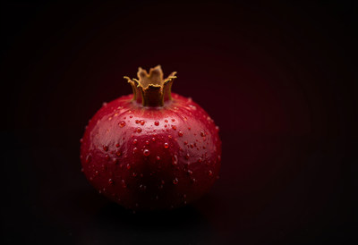 Fresh Pomegranate on Black Background