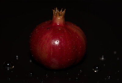 Ripe Pomegranate with Water Droplets