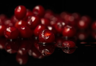 Red Cherries on Black Background