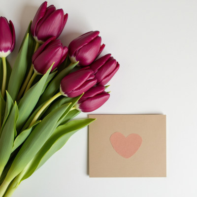 Beautiful bouquet of tulips with a heart greeting card