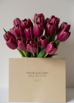Elegant bouquet of purple tulips in a simple vase