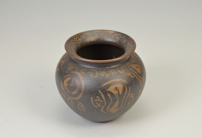 Artisan clay pot with intricate designs