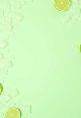 Refreshing lime drink surrounded by ice cubes