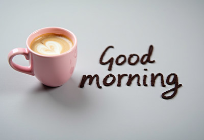 Warm cup of coffee with a message in the morning