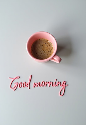 Morning coffee in a pink mug with cheerful greeting