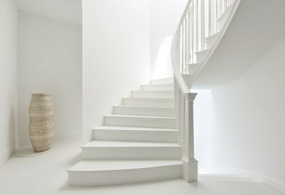 Elegant white staircase in modern interior design setting
