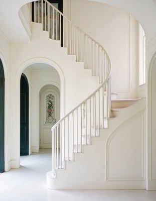 Elegant white staircase in a modern interior space