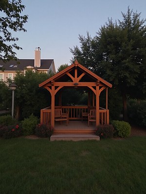 Wooden gazebo in a serene garden setting at dusk