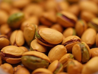Pistachios in vibrant golden shells ready for consumption
