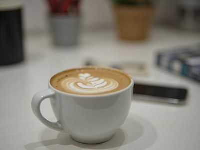 Enjoying latte art in a cozy cafe setting