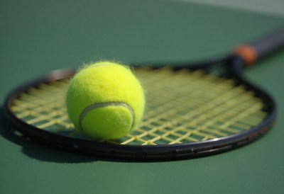 Tennis ball ready for a serve on the court