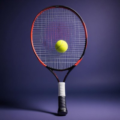 Tennis racket and ball poised for action in sport setting