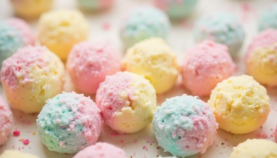 Colorful dessert balls in pastel shades on a bright surface