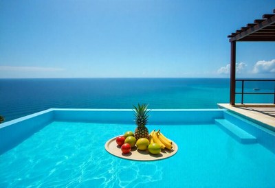 Luxurious poolside fruit display with ocean view
