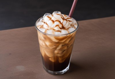Refreshing iced coffee with caramel drizzle at a cafe