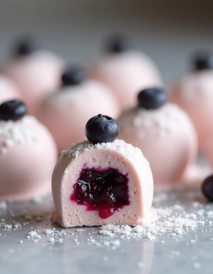 Delicious pink dessert with berry filling on a table