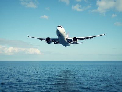 Aircraft soaring above the ocean during a clear day