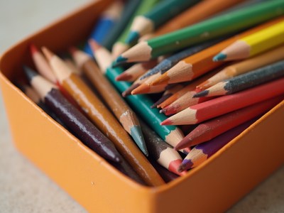 Colorful pencils neatly arranged in a box for drawing