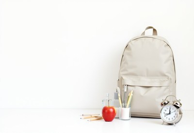 Backpack with school supplies and a healthy snack