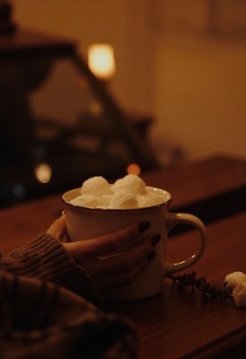 Cozy evening with a warm drink and marshmallows