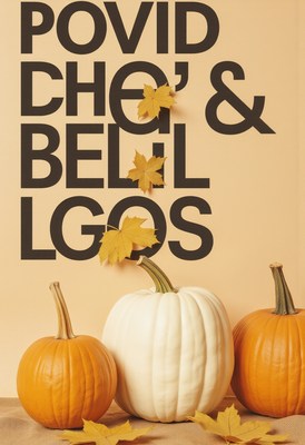 Decorative pumpkins with autumn leaves in a warm setting