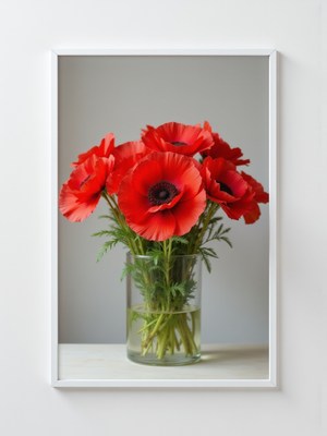 Bright red poppies in a glass vase on a table