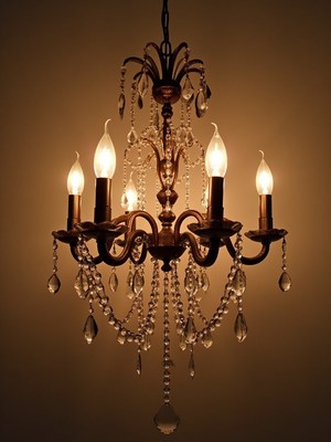 Elegant chandelier illuminating a warm room setting