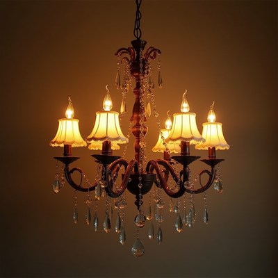 Elegant chandelier with warm glow in a dimly lit room