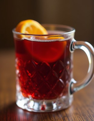 Warm drink with citrus slice in cozy setting