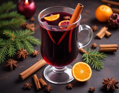 Warm spiced drink with citrus and cinnamon in cozy setting