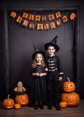 Kids celebrate halloween in costumes and decorations