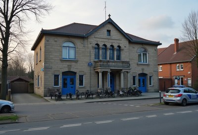 Historic building with blue doors and bicycles outside